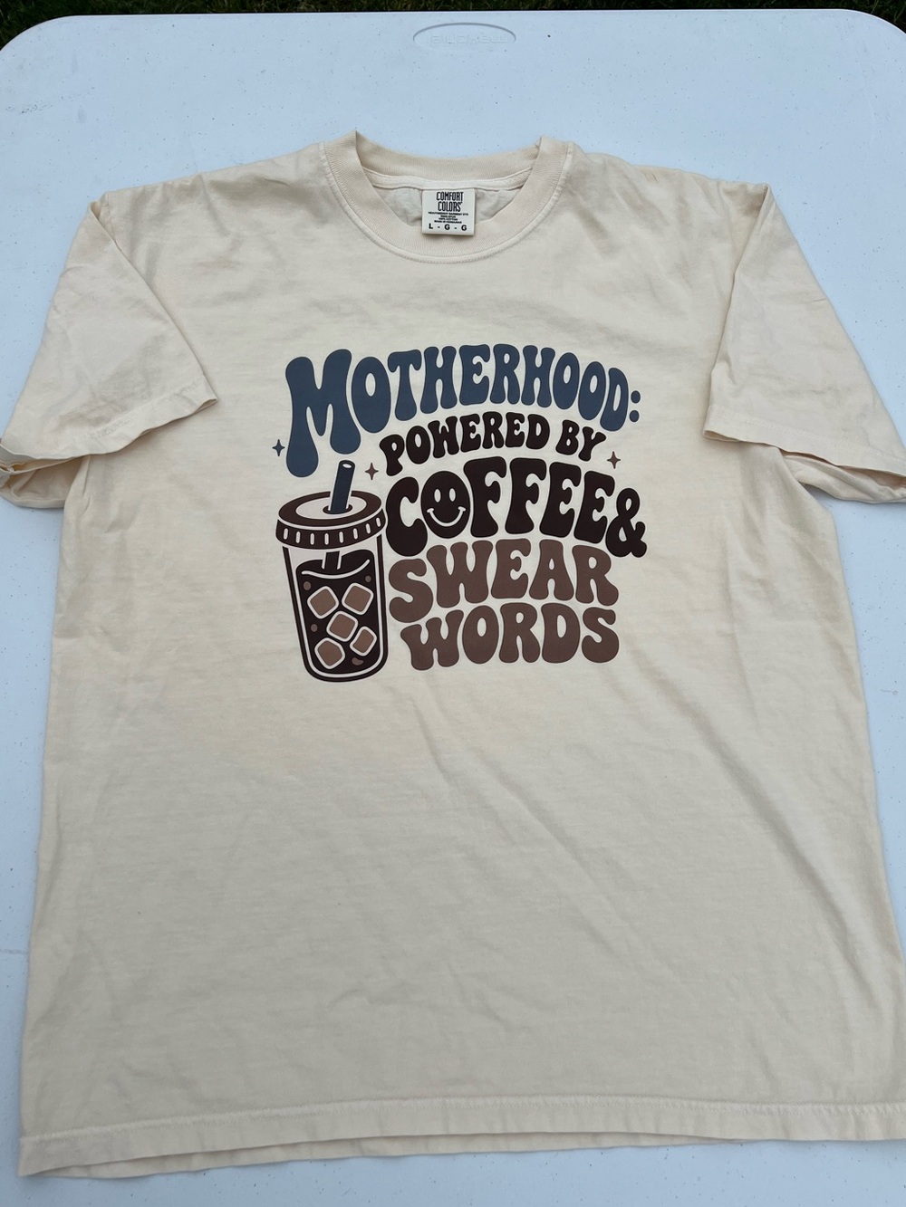 "Motherhood: Powered by Coffee & Swear Words" graphic tee. Comfort colors ivory